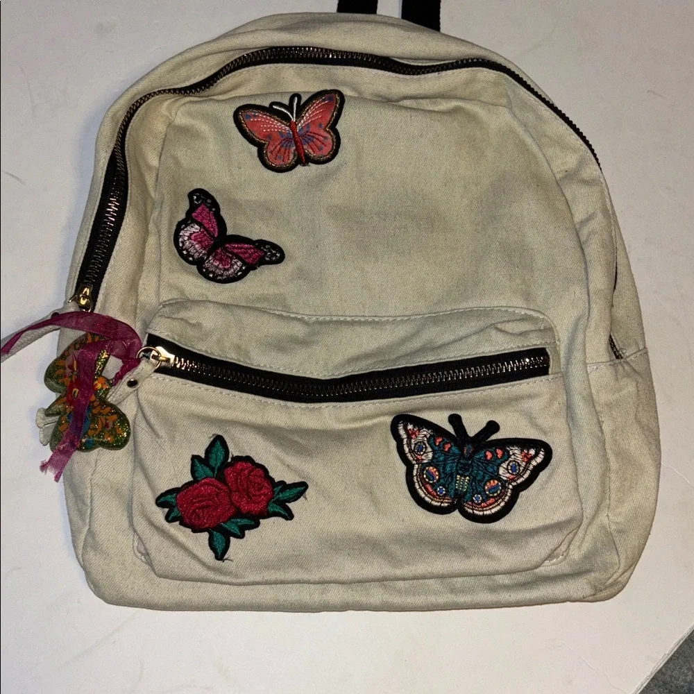 ATMOSPHERE BRAND OFF WHITE DENIM BACKPACK WITH BUTTERFLY PATCH DESIGN   PRELOVED
